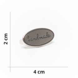 Étiquette en métal "Fait...